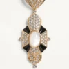 Boucles d’oreilles Pas Plus en métal, résine, émail et cristaux Swarovski® Boucles d’oreilles Pas Plus en métal, résine, émail et cristaux Swarovski®