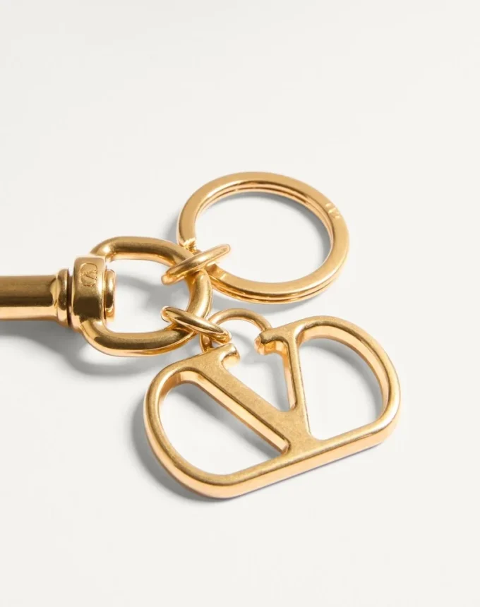 Charm métallique Vlogo Signature avec porte-clés