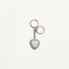 Charm pour sac Coeur Hyperbole avec porte-clés en métal, matière synthétique et cristaux Charm pour sac Coeur Hyperbole avec porte-clés en métal, matière synthétique et cristaux