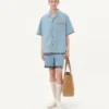 Chemise de bowling en denim avec bordure à imprimé floral Chemise de bowling en denim avec bordure à imprimé floral