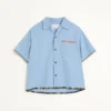 Chemise de bowling en denim avec bordure à imprimé floral Chemise de bowling en denim avec bordure à imprimé floral