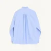 Chemise en coton avec plastron et volants Chemise en coton avec plastron et volants