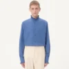 Chemise en popeline de coton avec plastron et volants Chemise en popeline de coton avec plastron et volants