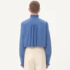 Chemise en popeline de coton avec plastron et volants Chemise en popeline de coton avec plastron et volants