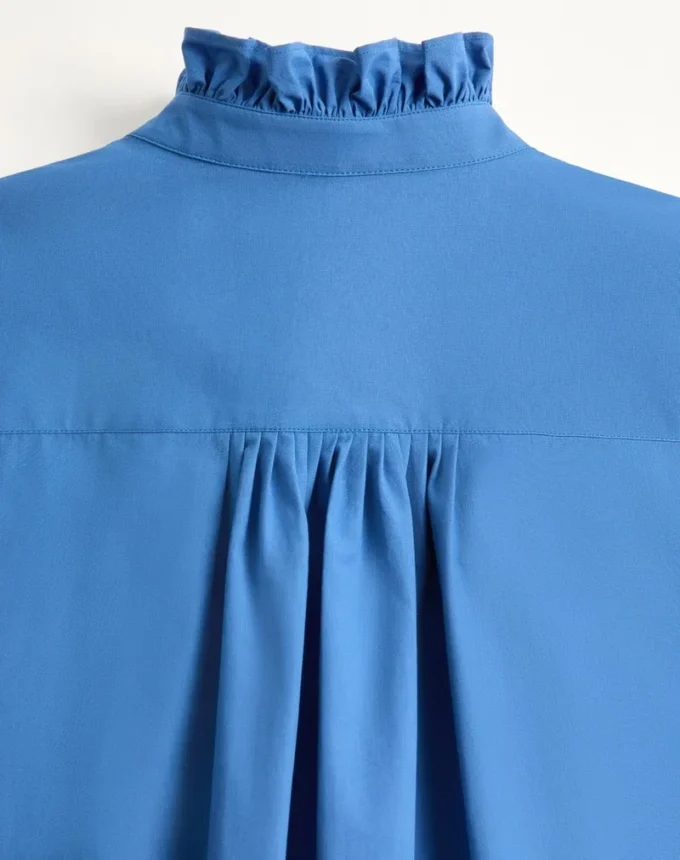 Chemise en popeline de coton avec plastron et volants Chemise en popeline de coton avec plastron et volants