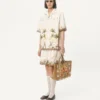 Chemise en toile de coton avec broderies florales Chemise en toile de coton avec broderies florales