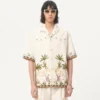 Chemise en toile de coton avec broderies florales Chemise en toile de coton avec broderies florales