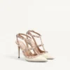 Escarpins à bride Rockstud en cuir verni 100 mm Escarpins à bride Rockstud en cuir verni 100 mm