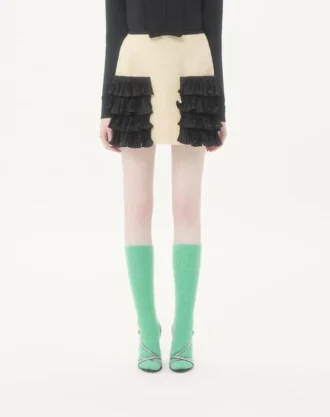 Jupe courte en tweed de laine uni