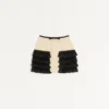 Jupe courte en tweed de laine uni Jupe courte en tweed de laine uni