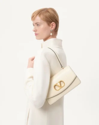 Manteau drapé compact