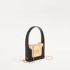 Minaudière Minaumorphe Valentino Garavani en métal avec cristaux Swarovski® et étui en satin Minaudière Minaumorphe Valentino Garavani en métal avec cristaux Swarovski® et étui en satin