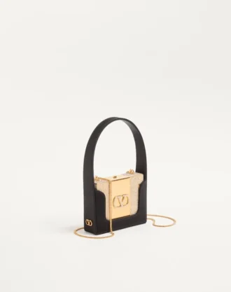 Minaudière Minaumorphe Valentino Garavani en métal avec cristaux Swarovski® et étui en satin