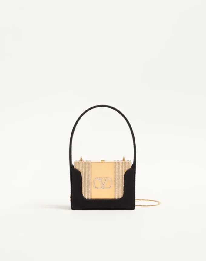 Minaudière Minaumorphe Valentino Garavani en métal avec cristaux Swarovski® et étui en satin Minaudière Minaumorphe Valentino Garavani en métal avec cristaux Swarovski® et étui en satin