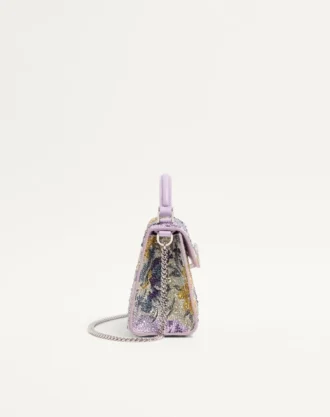Mini sac à main Valentino Garavani Vsling avec motif Flowerism en strass et logo bijou