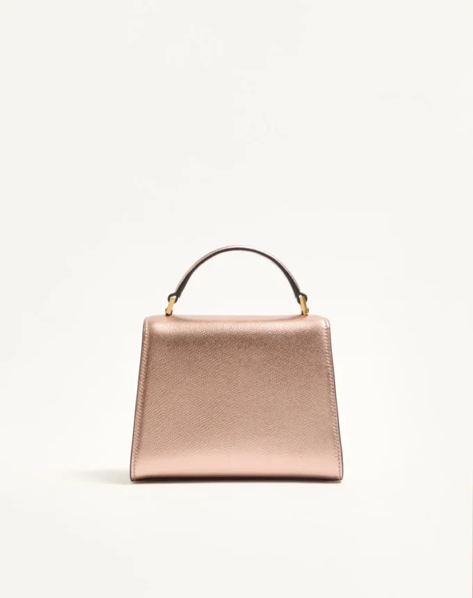 Mini sac à main Valentino Garavani Vsling en cuir de veau grainé laminé avec logo bijou Mini sac à main Valentino Garavani Vsling en cuir de veau grainé laminé avec logo bijou
