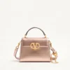 Mini sac à main Valentino Garavani Vsling en cuir de veau grainé laminé avec logo bijou Mini sac à main Valentino Garavani Vsling en cuir de veau grainé laminé avec logo bijou