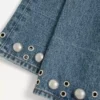 Pantalon en denim avec cabochons Pantalon en denim avec cabochons
