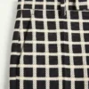 Pantalon en laine mélangée à carreaux avec revers Pantalon en laine mélangée à carreaux avec revers