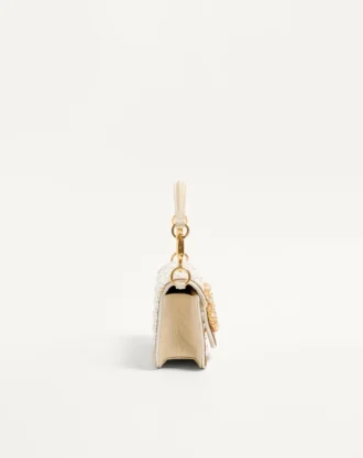 Petit sac à bandoulière brodé Valentino Garavani Locò avec logo bijou