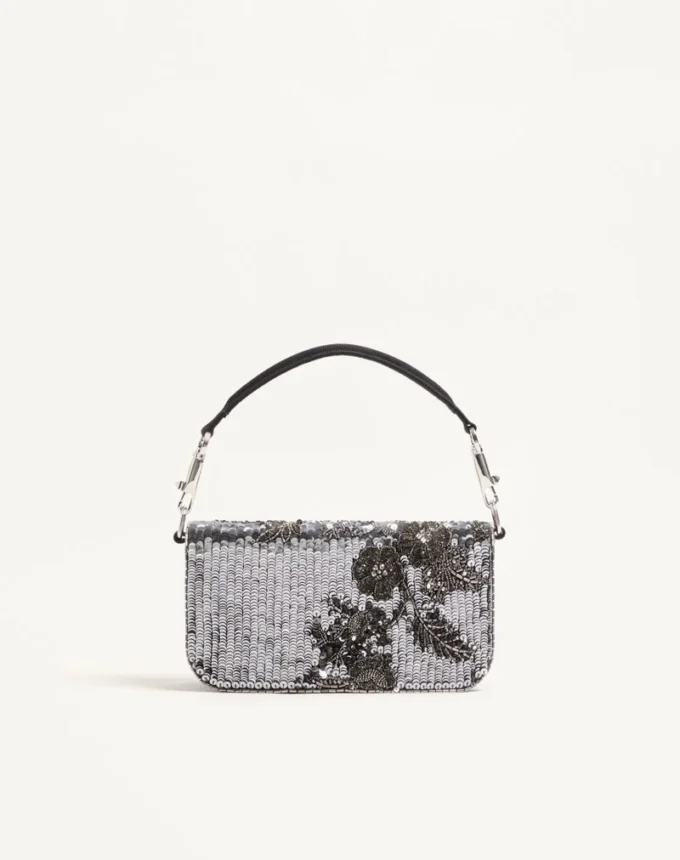 Petit sac à bandoulière brodé Valentino Garavani Locò avec logo bijou Petit sac à bandoulière brodé Valentino Garavani Locò avec logo bijou