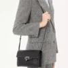 Petit sac à bandoulière Rockstud en cuir de veau grainé Petit sac à bandoulière Rockstud en cuir de veau grainé