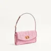 Petit sac à bandoulière Valentino Garavani DeVain en tissu jacquard cloqué. Petit sac à bandoulière Valentino Garavani DeVain en tissu jacquard cloqué.