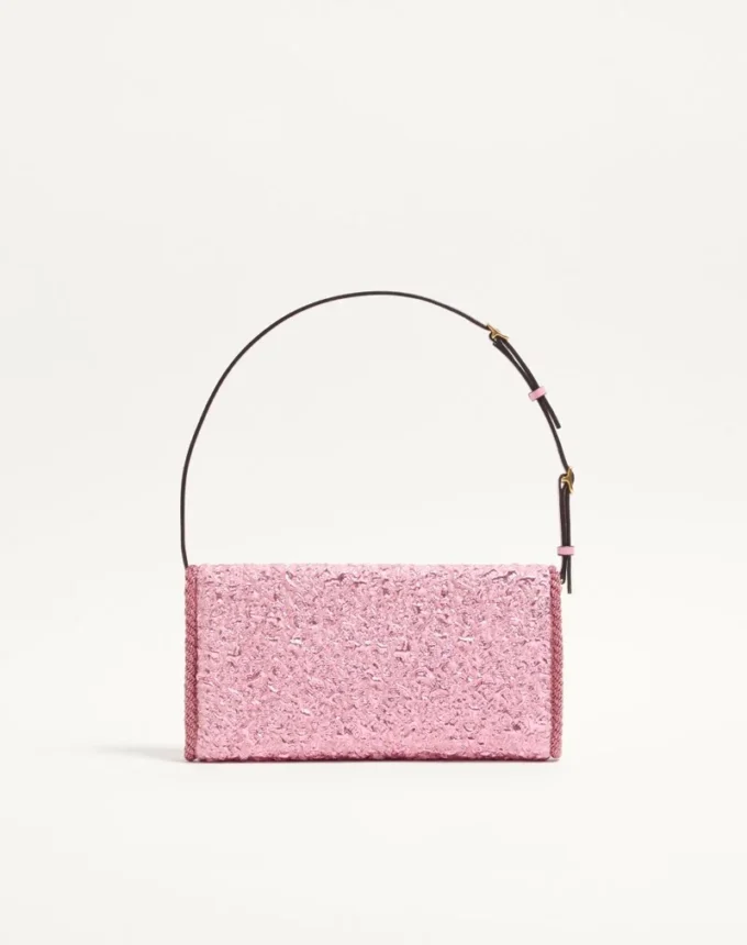 Petit sac à bandoulière Valentino Garavani DeVain en tissu jacquard cloqué. Petit sac à bandoulière Valentino Garavani DeVain en tissu jacquard cloqué.