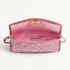 Petit sac à bandoulière Valentino Garavani DeVain en tissu jacquard cloqué. Petit sac à bandoulière Valentino Garavani DeVain en tissu jacquard cloqué.