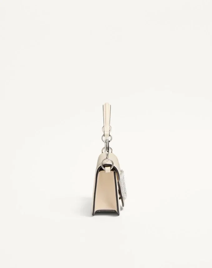 Petit sac à bandoulière Valentino Garavani Locò avec logo bijou Petit sac à bandoulière Valentino Garavani Locò avec logo bijou