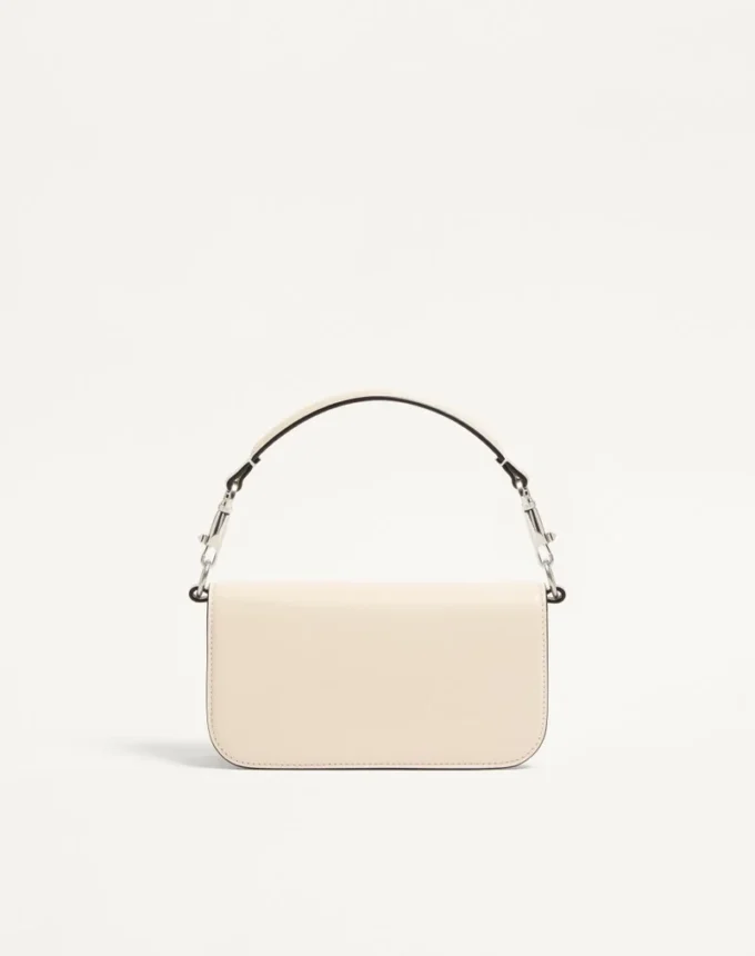 Petit sac à bandoulière Valentino Garavani Locò avec logo bijou Petit sac à bandoulière Valentino Garavani Locò avec logo bijou