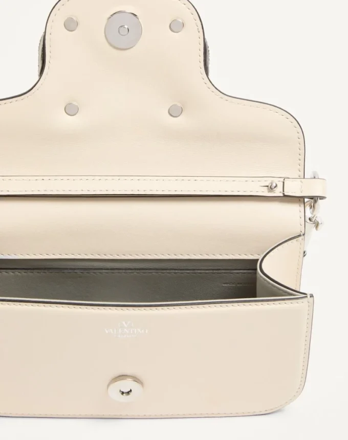 Petit sac à bandoulière Valentino Garavani Locò avec logo bijou Petit sac à bandoulière Valentino Garavani Locò avec logo bijou