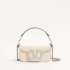 Petit sac à bandoulière Valentino Garavani Locò avec logo bijou Petit sac à bandoulière Valentino Garavani Locò avec logo bijou