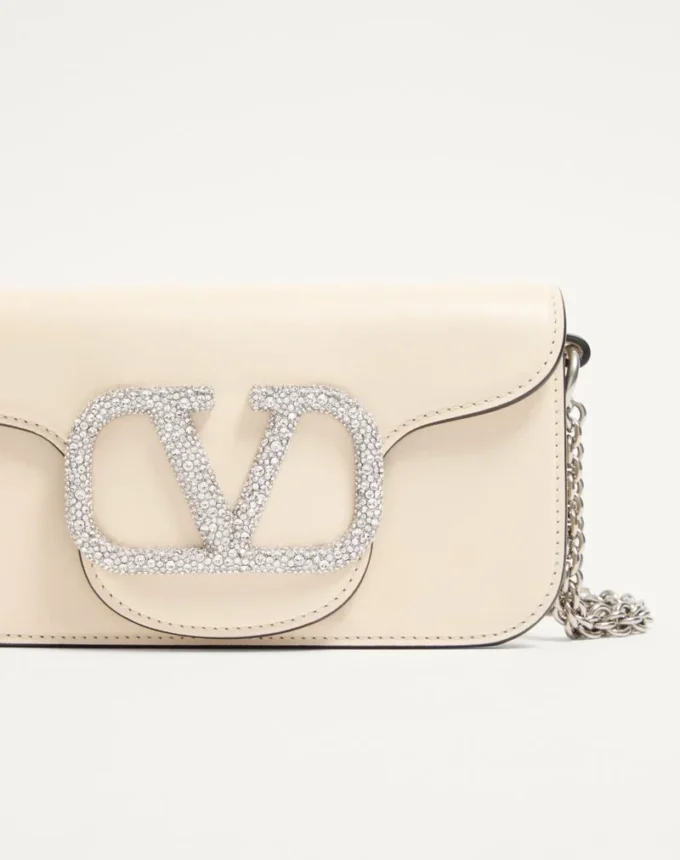 Petit sac à bandoulière Valentino Garavani Locò avec logo bijou Petit sac à bandoulière Valentino Garavani Locò avec logo bijou