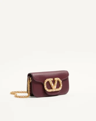 Petit sac à bandoulière Valentino Garavani Locò en cuir de veau avec logo bijou