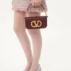 Petit sac à bandoulière Valentino Garavani Locò en cuir de veau avec logo bijou Petit sac à bandoulière Valentino Garavani Locò en cuir de veau avec logo bijou