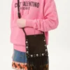 Petit sac à bandoulière Valentino Garavani Nellcôte en daim avec franges Petit sac à bandoulière Valentino Garavani Nellcôte en daim avec franges
