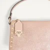 Petit sac à bandoulière Valentino Garavani Rockstud en cuir de veau grainé laminé Petit sac à bandoulière Valentino Garavani Rockstud en cuir de veau grainé laminé