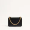Petit sac à bandoulière Valentino Garavani Vain en cuir de veau brillant Petit sac à bandoulière Valentino Garavani Vain en cuir de veau brillant