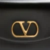 Petit sac à bandoulière Valentino Garavani Vain en cuir de veau brillant Petit sac à bandoulière Valentino Garavani Vain en cuir de veau brillant