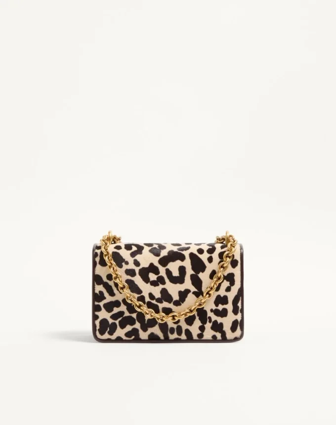 Petit sac à bandoulière Valentino Garavani Vain en cuir de veau effet poney avec imprimé animalier Petit sac à bandoulière Valentino Garavani Vain en cuir de veau effet poney avec imprimé animalier