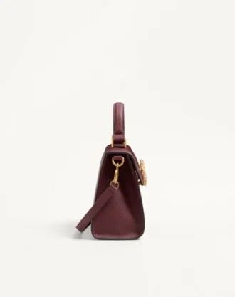 Petit sac à main Valentino Garavani Vsling en cuir de veau grainé avec logo bijou