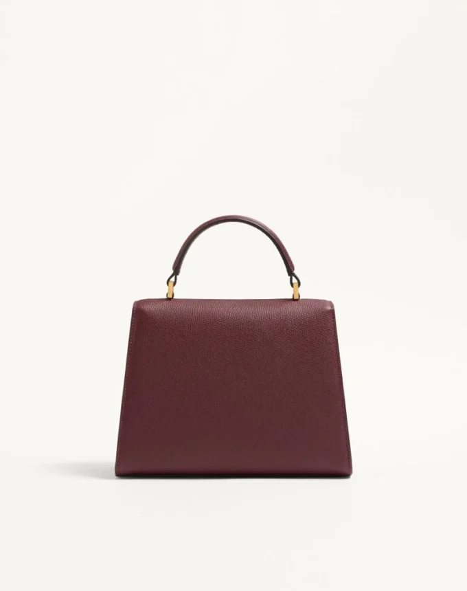 Petit sac à main Valentino Garavani Vsling en cuir de veau grainé avec logo bijou Petit sac à main Valentino Garavani Vsling en cuir de veau grainé avec logo bijou