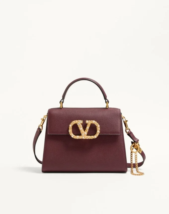 Petit sac à main Valentino Garavani Vsling en cuir de veau grainé avec logo bijou Petit sac à main Valentino Garavani Vsling en cuir de veau grainé avec logo bijou