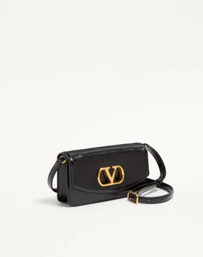 Pochette Valentino Garavani Vain en cuir de veau brillant Pochette Valentino Garavani Vain en cuir de veau brillant