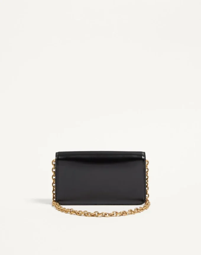 Pochette Valentino Garavani Vain en cuir de veau brillant Pochette Valentino Garavani Vain en cuir de veau brillant