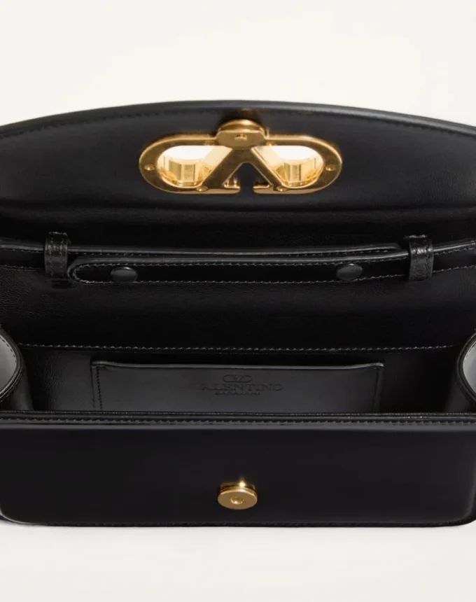 Pochette Valentino Garavani Vain en cuir de veau brillant Pochette Valentino Garavani Vain en cuir de veau brillant