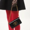 Pochette Valentino Garavani Vain en cuir de veau brillant Pochette Valentino Garavani Vain en cuir de veau brillant
