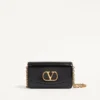 Pochette Valentino Garavani Vain en cuir de veau brillant Pochette Valentino Garavani Vain en cuir de veau brillant