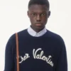 Pull en laine à col rond avec broderie Chez Valentino Pull en laine à col rond avec broderie Chez Valentino
